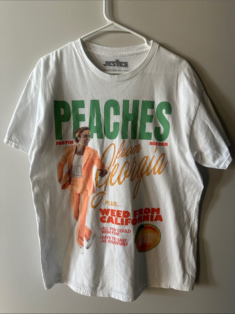 Justin Bieber White Graphic Tee with Green and Orange Print - Peaches Design